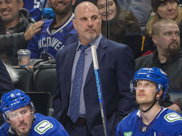 VANCOUVER, CANADA - JANUARY 16: Head coach Rick Tocchet, J.T. Miller #9 and Elias Pettersson #40 of the Vancouver Canucks during the third period of their NHL game against the Los Angeles Kings at Rogers Arena on January 16, 2025 in Vancouver, British Columbia, Canada.