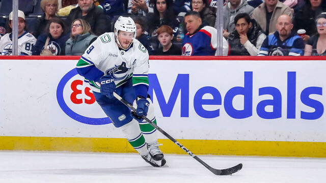 WINNIPEG, CANADA - JANUARY 14: J.T. Miller #9 of the Vancouver Canucks carries the puck down the ice during third period action against the Winnipeg Jets at the Canada Life Centre on January 14, 2025 in Winnipeg, Manitoba, Canada. The Jets defeated the Canucks 6-1.