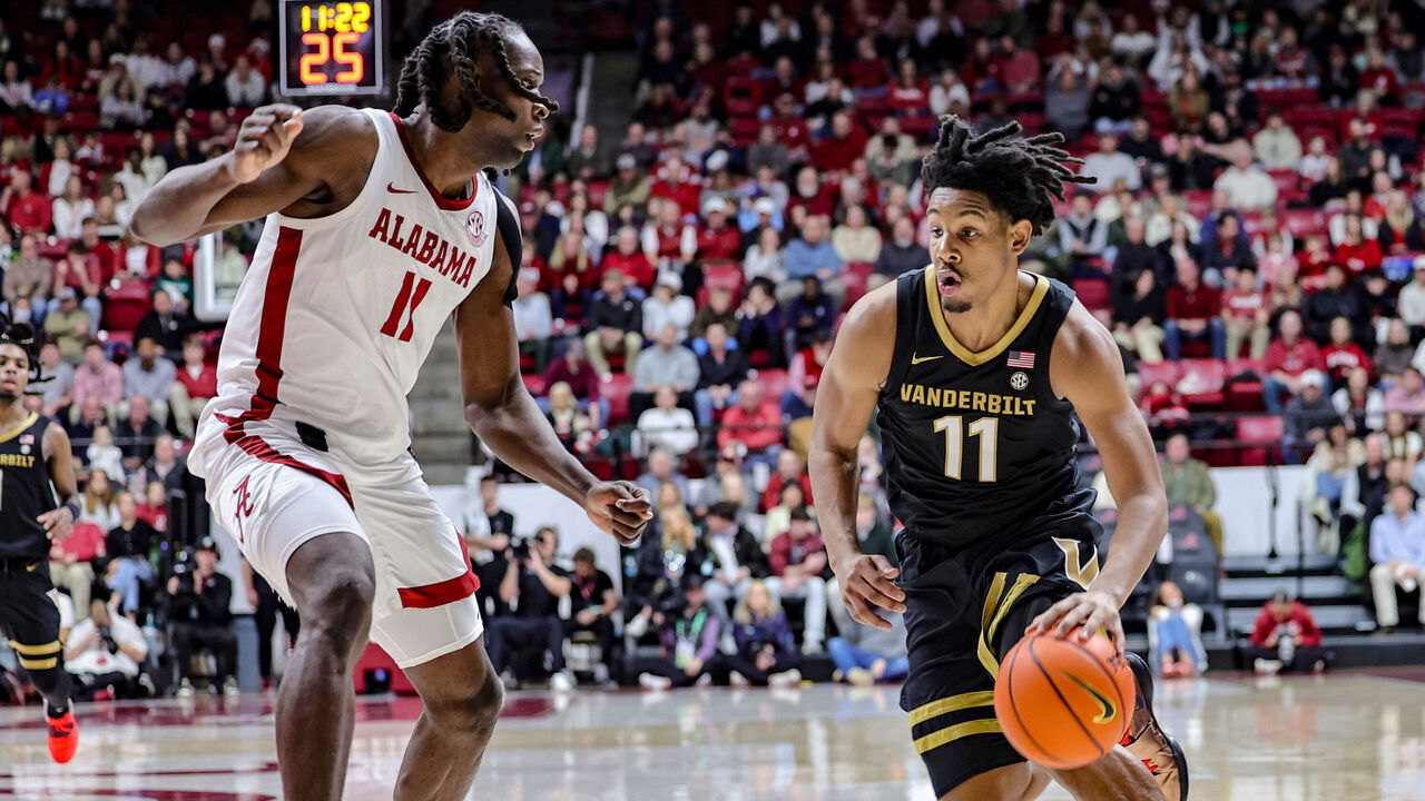 TUSCALOOSA, ALABAMA - JANUARY 21: AJ Hoggard #11 of the Vanderbilt Commodores drives to the basket during the first half against Clifford Omoruyi #11 of the Alabama Crimson Tide at Coleman Coliseum on January 21, 2025 in Tuscaloosa, Alabama.