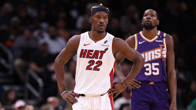 PHOENIX, ARIZONA - NOVEMBER 06: Jimmy Butler #22 of the Miami Heat and Kevin Durant #35 of the Phoenix Suns looks on during the game at Footprint Center on November 06, 2024 in Phoenix, Arizona. The Suns defeated the Heat 115-112.