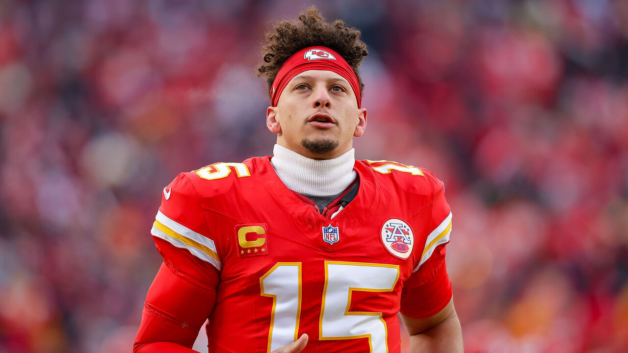 KANSAS CITY, MISSOURI - JANUARY 18: Patrick Mahomes #15 of the Kansas City Chiefs runs down the sideline prior to the beginning of the Divisional Round playoff game against the Houston Texans at GEHA Field at Arrowhead Stadium on January 18, 2025 in Kansas City, Missouri.