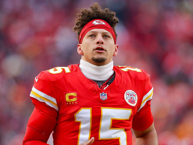 KANSAS CITY, MISSOURI - JANUARY 18: Patrick Mahomes #15 of the Kansas City Chiefs runs down the sideline prior to the beginning of the Divisional Round playoff game against the Houston Texans at GEHA Field at Arrowhead Stadium on January 18, 2025 in Kansas City, Missouri.
