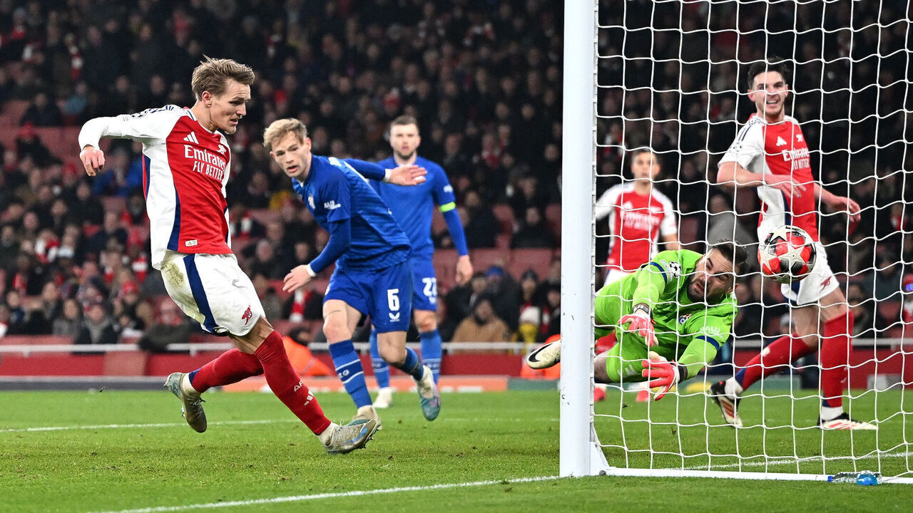 Arsenal's Norwegian midfielder #08 Martin Odegaard scores his team's third goal during the UEFA Champions League football match between Arsenal and Dinamo Zagreb at the Emirates Stadium in north London on January 22, 2025.