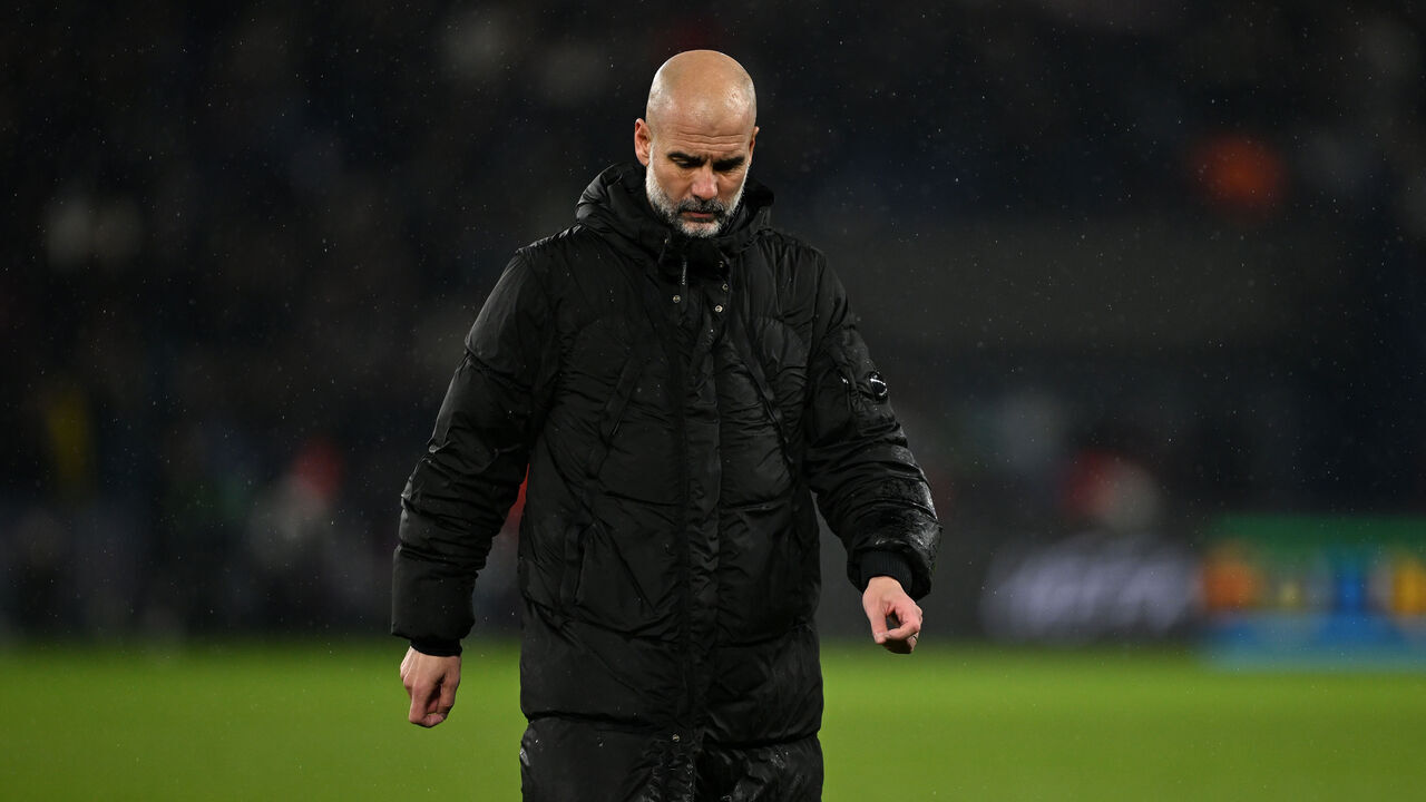 PARIS, FRANCE - JANUARY 22: Pep Guardiola, Manager of Manchester City, looks dejected after the team's defeat in the UEFA Champions League 2024/25 League Phase MD7 match between Paris Saint-Germain and Manchester City at Parc des Princes on January 22, 2025 in Paris, France.
