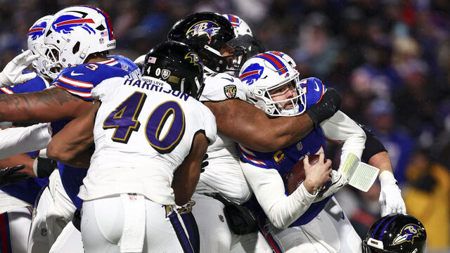 ORCHARD PARK, NEW YORK - JANUARY 19: Michael Pierce #58 of the Baltimore Ravens tackles Josh Allen #17 of the Buffalo Bills during the second half of an NFL football divisional playoff game at Highmark Stadium on January 19, 2025 in Orchard Park, New York.