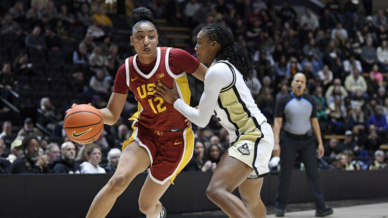 WEST LAFAYETTE, IN - JANUARY 22: USC Trojans Guard JuJu Watkins (12) dribbles as Purdue Boilermakers Guard Rashunda Jones (2) defends during the women's college basketball game between the USC Trojans and the Purdue Boilermakers on January 22, 2025, at Mackey Arena in West Lafayette, Indiana.