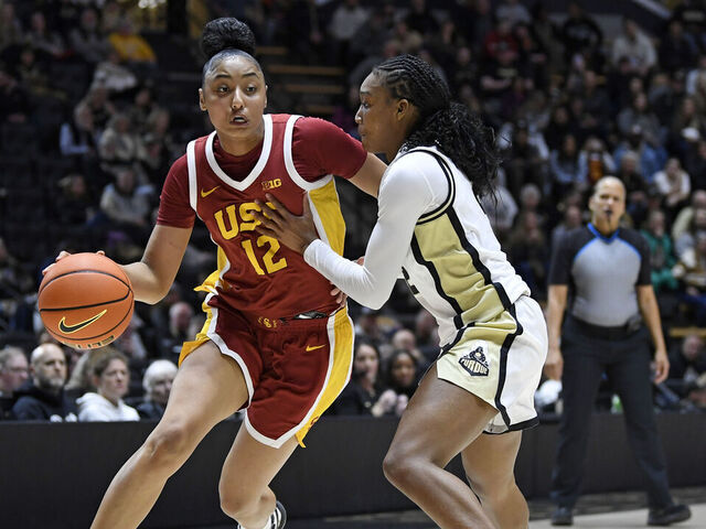 WEST LAFAYETTE, IN - JANUARY 22: USC Trojans Guard JuJu Watkins (12) dribbles as Purdue Boilermakers Guard Rashunda Jones (2) defends during the women's college basketball game between the USC Trojans and the Purdue Boilermakers on January 22, 2025, at Mackey Arena in West Lafayette, Indiana.