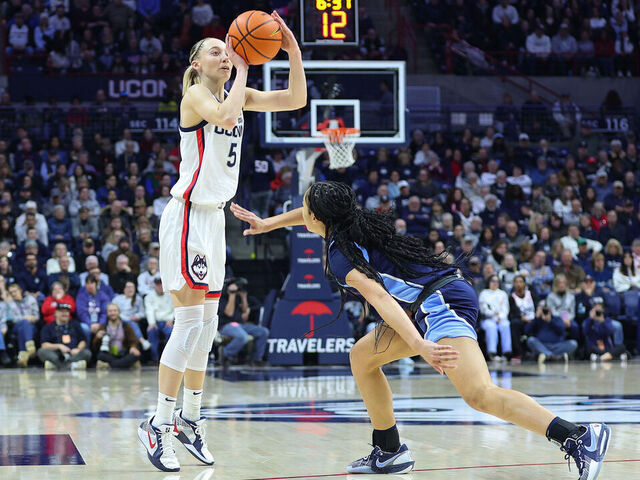 STORRS, CT - JANUARY 22: UConn Huskies guard Paige Bueckers (5) shoots a three point shot during the women's college basketball game between Villanova Wildcats and UConn Huskies on January 22, 2025, at Harry A. Gampel Pavilion in Storrs, CT.