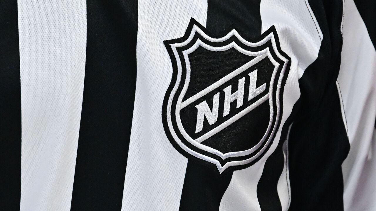 MONTREAL, CANADA - NOVEMBER 05: A closeup view of the NHL crest is seen on a referee jersey during the second period between the Montreal Canadiens and the Calgary Flames at the Bell Centre on November 5, 2024 in Montreal, Quebec, Canada. The Calgary Flames defeated the Montreal Canadiens 3-2 in overtime.