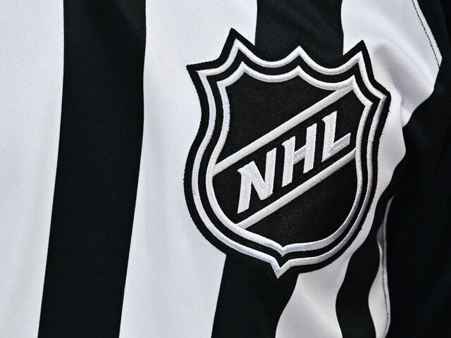 MONTREAL, CANADA - NOVEMBER 05: A closeup view of the NHL crest is seen on a referee jersey during the second period between the Montreal Canadiens and the Calgary Flames at the Bell Centre on November 5, 2024 in Montreal, Quebec, Canada. The Calgary Flames defeated the Montreal Canadiens 3-2 in overtime.