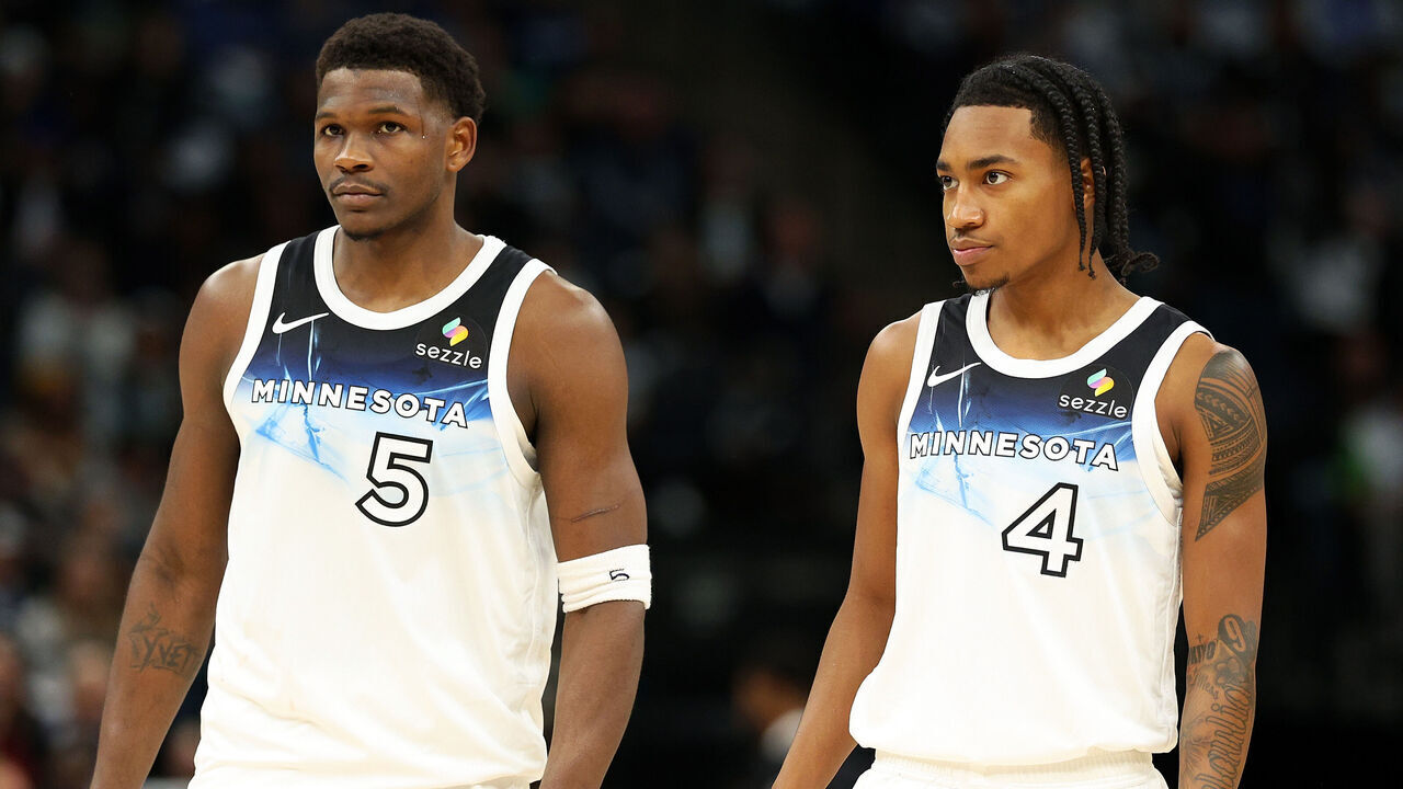 MINNEAPOLIS, MINNESOTA - NOVEMBER 17: Anthony Edwards #5 and Rob Dillingham #4 of the Minnesota Timberwolves look on against the Phoenix Suns in the second quarter at Target Center on November 17, 2024 in Minneapolis, Minnesota. The Timberwolves defeated the Suns 120-117.