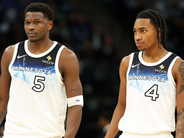MINNEAPOLIS, MINNESOTA - NOVEMBER 17: Anthony Edwards #5 and Rob Dillingham #4 of the Minnesota Timberwolves look on against the Phoenix Suns in the second quarter at Target Center on November 17, 2024 in Minneapolis, Minnesota. The Timberwolves defeated the Suns 120-117.