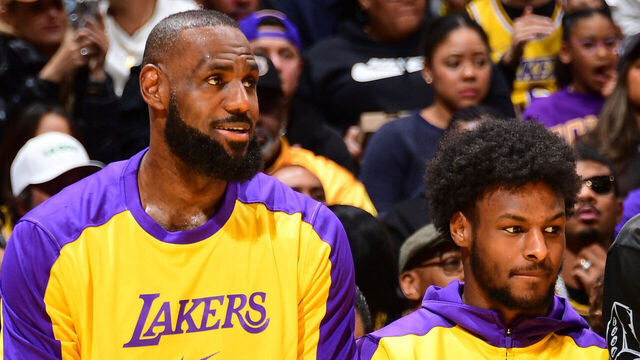 LOS ANGELES, CA - JANUARY 3: LeBron James #23 and Bronny James #9 of the Los Angeles Lakers looks on during the game against the Atlanta Hawks on January 3, 2025 at Crypto.Com Arena in Los Angeles, California. NOTE TO USER: User expressly acknowledges and agrees that, by downloading and/or using this Photograph, user is consenting to the terms and conditions of the Getty Images License Agreement. Mandatory Copyright Notice: Copyright 2025 NBAE