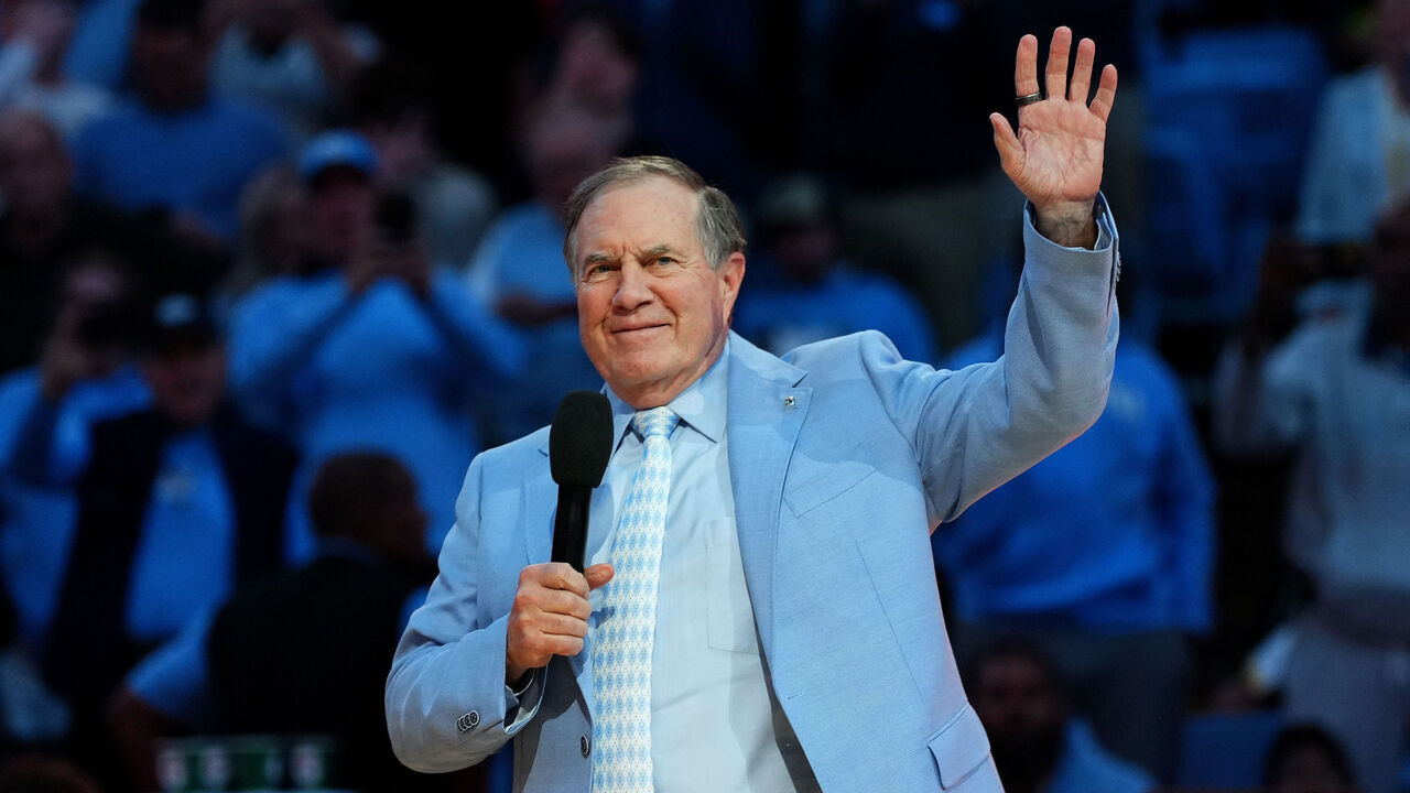 CHAPEL HILL, NORTH CAROLINA - DECEMBER 14: Head coach Bill Belichick of the North Carolina Tar Heels addresses the crowd during halftime in the game against the La Salle Explorers at the Dean E. Smith Center on December 14, 2024 in Greensboro, North Carolina.
