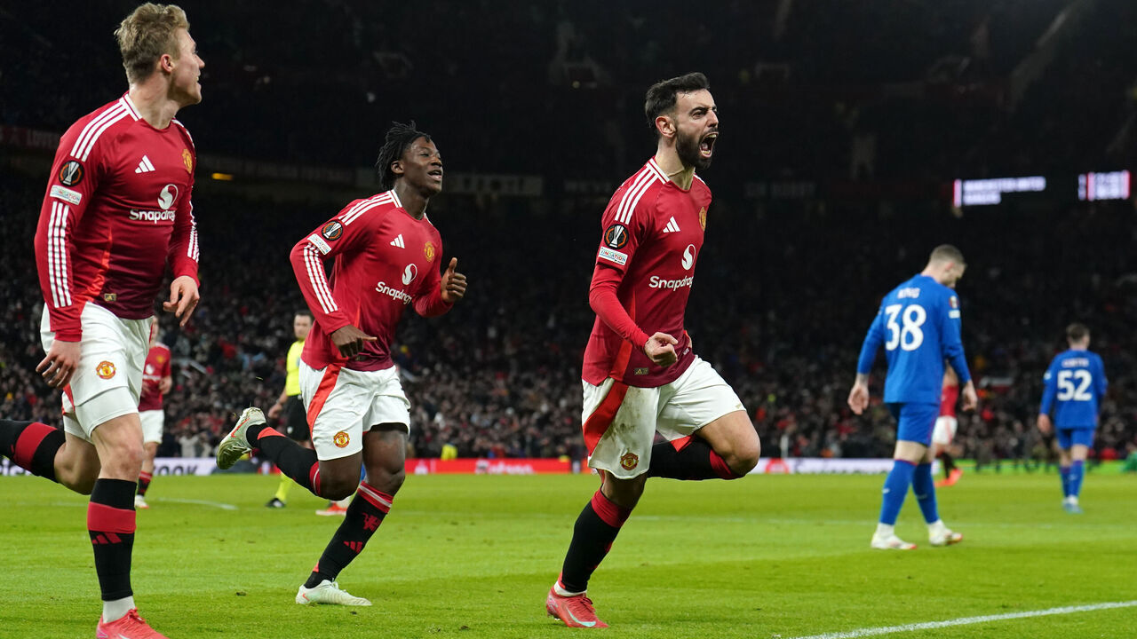 Manchester United's Bruno Fernandes (right) celebrates scoring their side's second goal of the game during the UEFA Europa League, league stage match at Old Trafford, Manchester. Picture date: Thursday January 23, 2025.