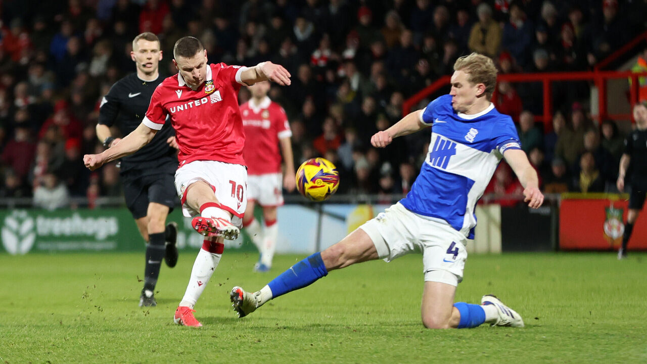 WREXHAM, WALES - JANUARY 23: Paul Mullin of Wrexham shoots at goal during the Sky Bet League One match between Wrexham AFC and Birmingham City FC at the SToK Cae Ras on January 23, 2025 in Wrexham, Wales.