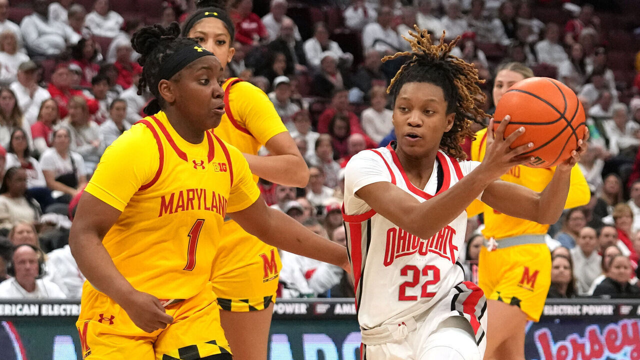 COLUMBUS, OH - JANUARY 23: Ohio State Buckeyes guard Jaloni Cambridge (22) drives to the basket against Maryland Terrapins guard Sarah Te-Biasu (1) during the game between the Ohio State Buckeyes and the Maryland Terrapins at Value City Arena in Columbus, Ohio on January 23, 2025.