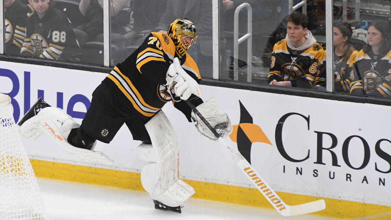 BOSTON, MASSACHUSETTS - JANUARY 23: Joonas Korpisalo #70 of the Boston Bruins passes the puck against the Ottawa Senators on January 23, 2025, at the TD Garden in Boston, Massachusetts.