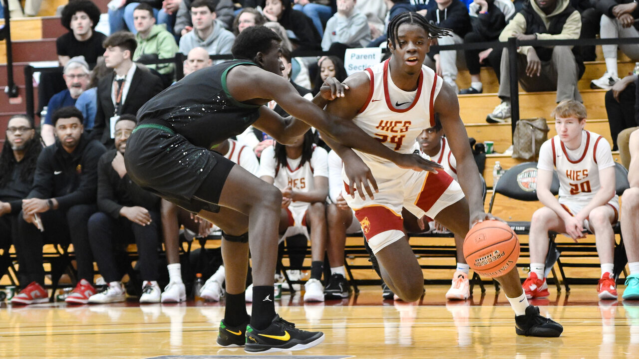 SPRINGFIELD, MA - JANUARY 18: Caleb Wilson of Holy Innocents (24) drives past Williams Sacre of St. Joseph (5) during the Spalding Hoophall Classic high school basketball game between Holy Innocents School and St. Joseph on January 18, 2025 at Blake Arena in Springfield, MA