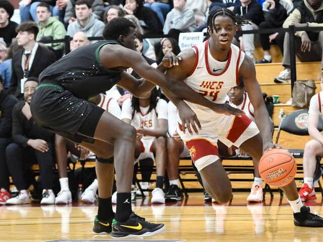 SPRINGFIELD, MA - JANUARY 18: Caleb Wilson of Holy Innocents (24) drives past Williams Sacre of St. Joseph (5) during the Spalding Hoophall Classic high school basketball game between Holy Innocents School and St. Joseph on January 18, 2025 at Blake Arena in Springfield, MA