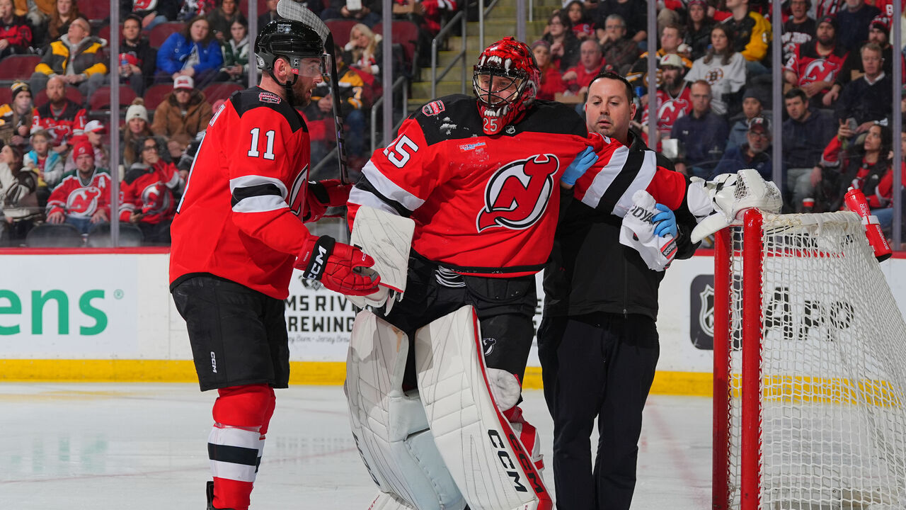 NEWARK, NJ - JANUARY 22: Jacob Markstrom #25 of the New Jersey Devils is helped off the ice in the second period of the game against the Boston Bruins at the Prudential Center on January 22, 2025 in Newark, New Jersey.