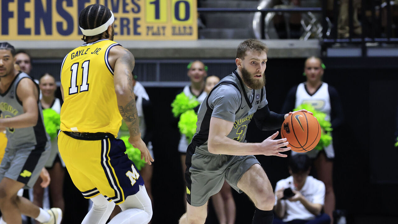 WEST LAFAYETTE, INDIANA - JANUARY 24: Braden Smith #3 of the Purdue Boilermakers brings the ball up the court against Roddy Gayle Jr. #11 of the Michigan Wolverines during the second half at Mackey Arena on January 24, 2025 in West Lafayette, Indiana.
