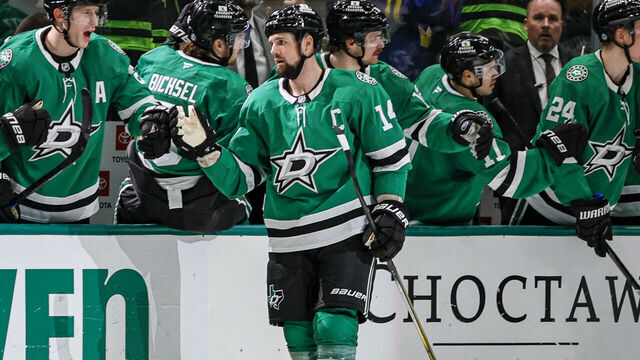 DALLAS, TX - JANUARY 24: Dallas Stars left wing Jamie Benn (14) gets high fives after a goal during the game between the Dallas Stars and the Vegas Golden Knights on January 24, 2025 at American Airlines Center in Dallas, Texas.