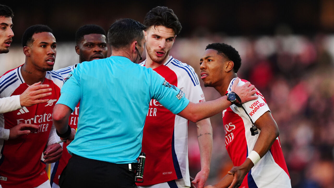 Arsenal's Myles Lewis-Skelly reacts after being shown a red card by referee Michael Oliver during the Premier League match at Molineux Stadium, Wolverhampton. Picture date: Saturday January 25, 2025.