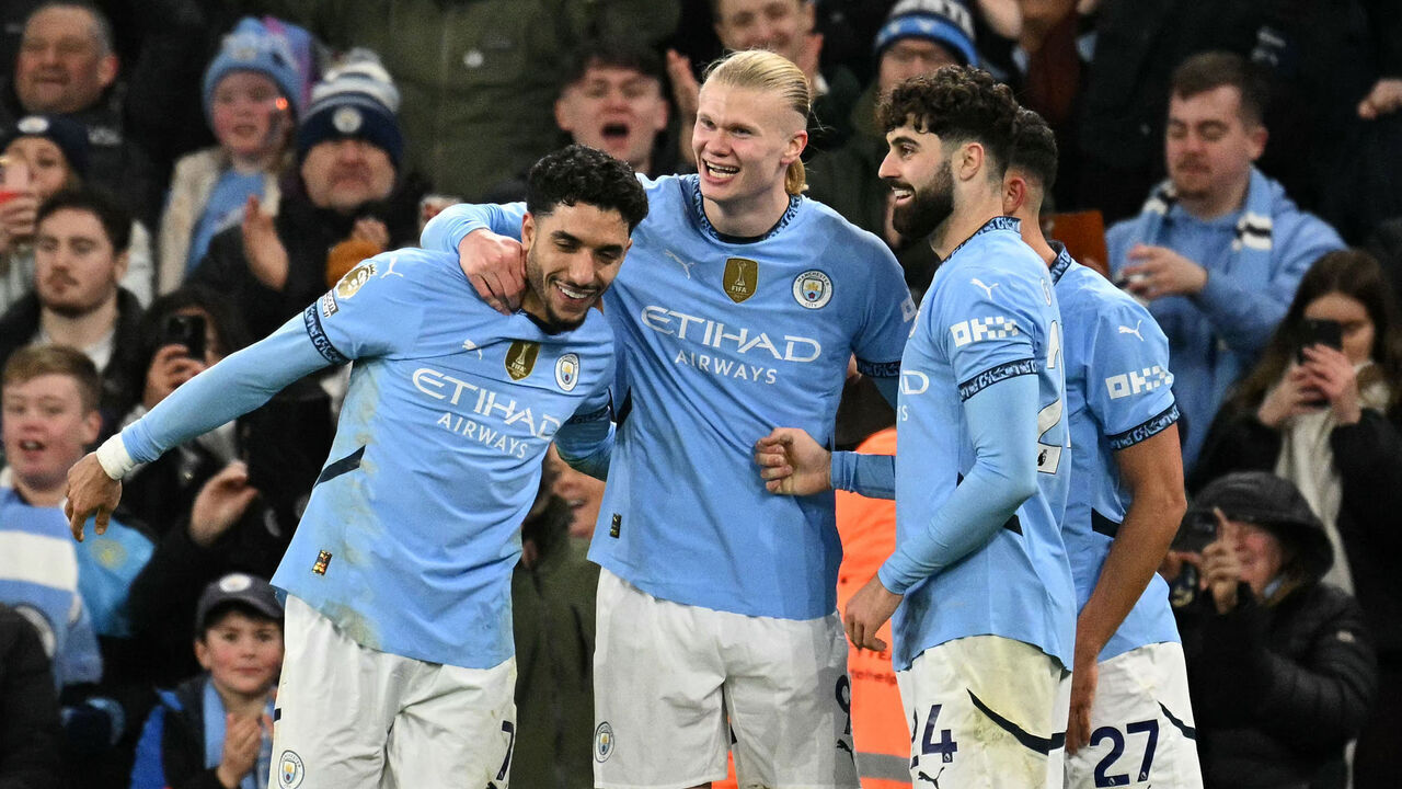 Manchester City's Norwegian striker #09 Erling Haaland celebrates scoring the team's second goal with Manchester City's Egyptian striker #07 Omar Marmoush (L) and Manchester City's Croatian defender #24 Josko Gvardiolduring the English Premier League football match between Manchester City and Chelsea at the Etihad Stadium in Manchester, north west England, on January 25, 2025.