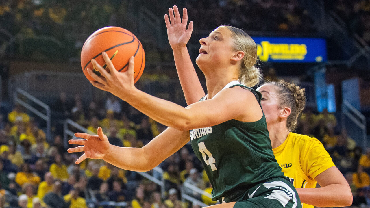 ANN ARBOR, MICHIGAN - JANUARY 25: Theryn Hallock #4 of the Michigan State Spartans against Jordan Hobbs #10 of the Michigan Wolverines during the second half of a women's basketball game at Crisler Arena on January 25, 2025 in Ann Arbor, Michigan. The Michigan State Spartans won the game 88-58.