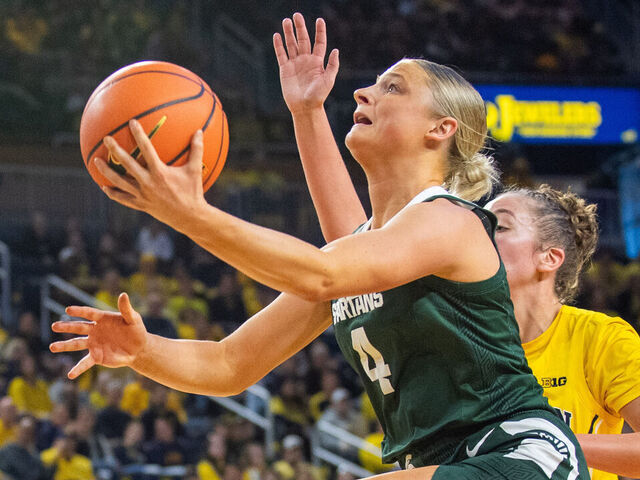 ANN ARBOR, MICHIGAN - JANUARY 25: Theryn Hallock #4 of the Michigan State Spartans against Jordan Hobbs #10 of the Michigan Wolverines during the second half of a women's basketball game at Crisler Arena on January 25, 2025 in Ann Arbor, Michigan. The Michigan State Spartans won the game 88-58.