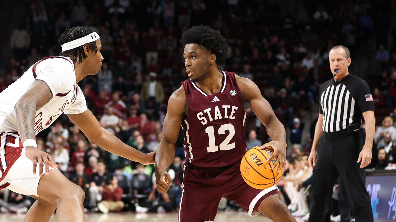 COLUMBIA, SOUTH CAROLINA - JANUARY 25: Josh Hubbard #12 of the Mississippi State Bulldogs dribbles the ball during the second half against Nick Pringle #5 of the South Carolina Gamecocks at Colonial Life Arena on January 25, 2025 in Columbia, South Carolina.