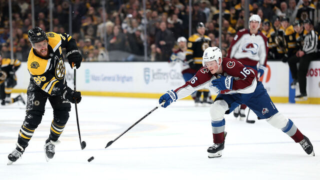 BOSTON, MASSACHUSETTS - JANUARY 25: David Pastrnak #88 of the Boston Bruins takes a shot to score against Juuso Parssinen #16 of the Colorado Avalanche during the third period at TD Garden on January 25, 2025 in Boston, Massachusetts. The Bruins defeat the Avalanche 3-1.
