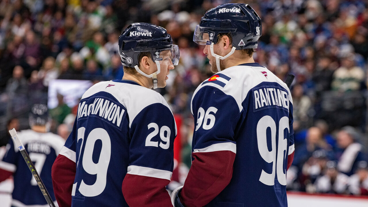 DENVER, COLORADO - JANUARY 20: (L-R) Nathan MacKinnon #29 and Mikko Rantanen #96 of the Colorado Avalanche talk during a pause in the game against the Minnesota Wildat Ball Arena on January 20, 2025 in Denver, Colorado.