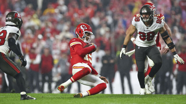 KANSAS CITY, MISSOURI - NOVEMBER 4: Patrick Mahomes #15 of the Kansas City Chiefs slides to the ground on a QB scramble during overtime against the Tampa Bay Buccaneers at GEHA Field at Arrowhead Stadium on November 4, 2024 in Kansas City, Missouri.