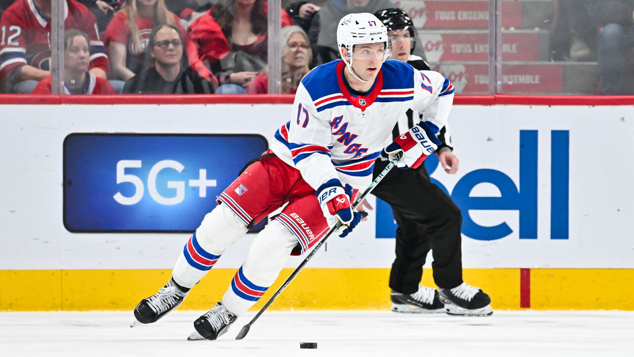 MONTREAL, CANADA - JANUARY 19: Will Borgen #17 of the New York Rangers skates the puck during the third period against the Montreal Canadiens at the Bell Centre on January 19, 2025 in Montreal, Quebec, Canada. The Montreal Canadiens defeated the New York Rangers 5-4 in overtime.