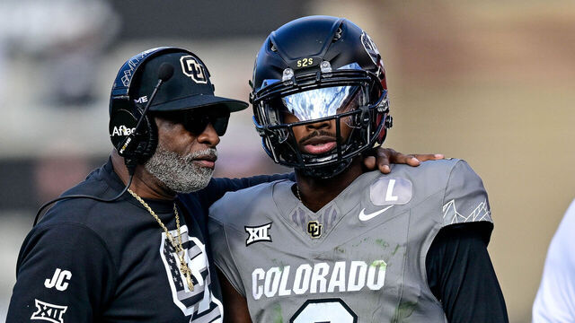 BOULDER, CO - NOVEMBER 16: Head coach Deion Sanders of the Colorado Buffaloes celebrates with Shedeur Sanders #2 after a fourth quarter touchdown against the Utah Utes at Folsom Field on November 16, 2024 in Boulder, Colorado.