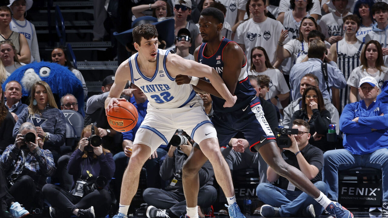 CINCINNATI, OH - JANUARY 25: Xavier Musketeers forward Zach Freemantle (32) tries to get to the basket while defended by Connecticut Huskies center Samson Johnson (35) during a college basketball game on Jan. 25, 2025 at Cintas Center in Cincinnati, Ohio.