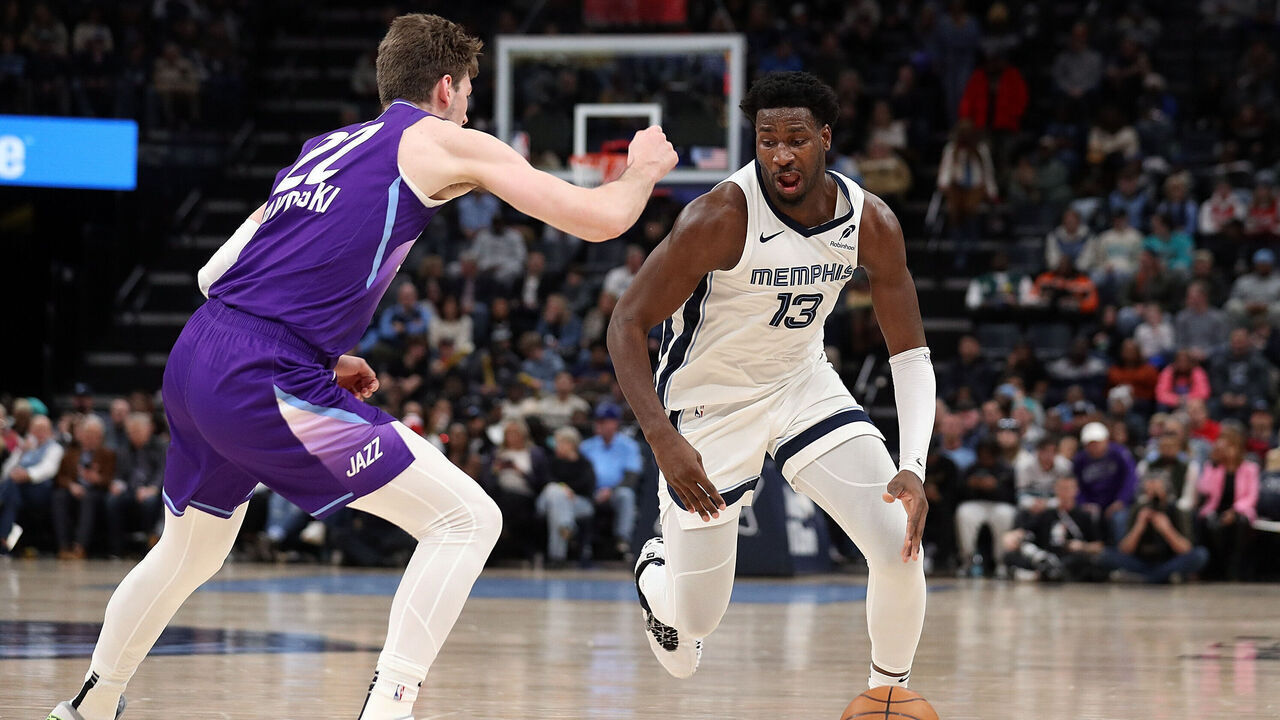 MEMPHIS, TENNESSEE - JANUARY 25: Jaren Jackson Jr. #13 of the Memphis Grizzlies handles the ball against Kyle Filipowski #22 of the Utah Jazz during the first half at FedExForum on January 25, 2025 in Memphis, Tennessee.