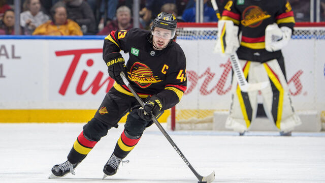 VANCOUVER, CANADA - JANUARY 25: Quinn Hughes #43 of the Vancouver Canucks skates up the ice during the third period of their NHL game against the Washington Capitals at Rogers Arena on January 25, 2025 in Vancouver, British Columbia, Canada.