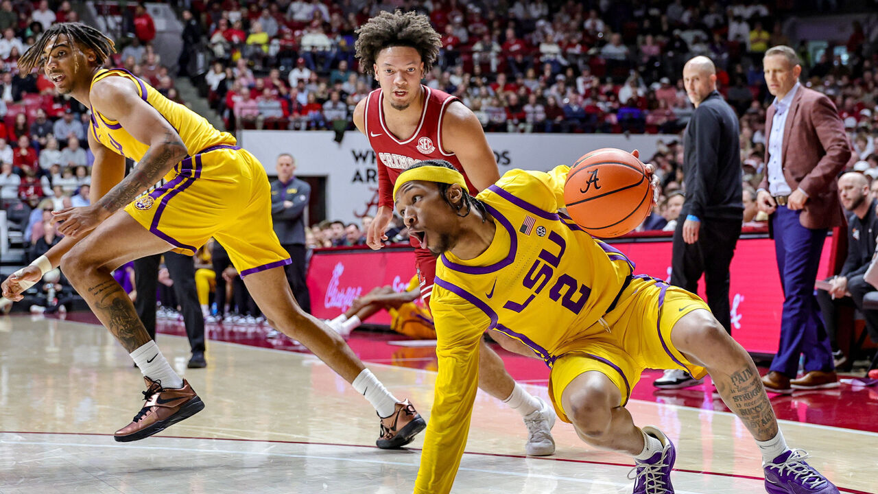 TUSCALOOSA, ALABAMA - JANUARY 25: Mike Williams III #2 of the LSU Tigers slips as he drives around Mark Sears #1 of the Alabama Crimson Tide during the first half at Coleman Coliseum on January 25, 2025 in Tuscaloosa, Alabama.