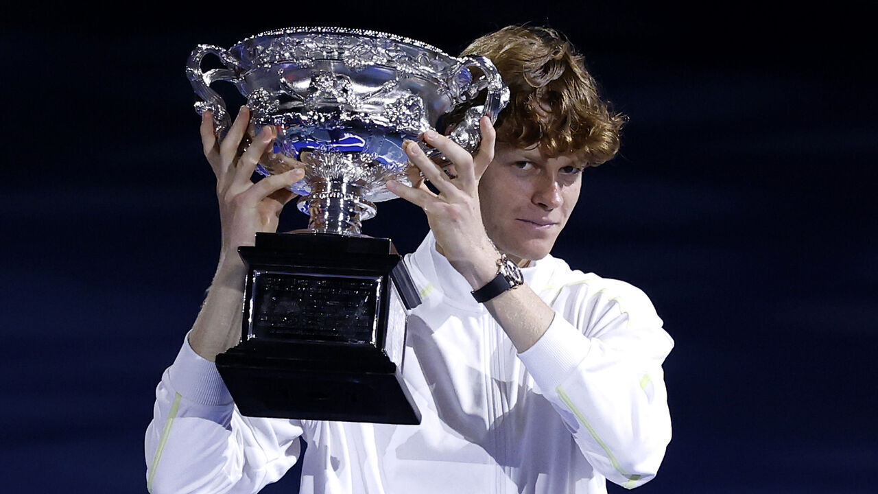 MELBOURNE, AUSTRALIA - JANUARY 26: Jannik Sinner of Italy is presented the Norman Brookes Challenge Cup at the Men's Singles trophy presentation following the Men's Singles final against Alexander Zverev of Germany during day 15 of the 2025 Australian Open at Melbourne Park on January 26, 2025 in Melbourne, Australia.