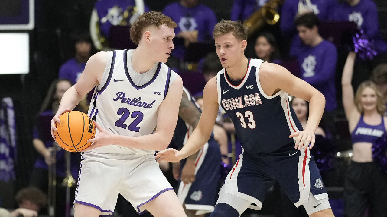PORTLAND, OREGON - JANUARY 25: Ben Gregg #33 of the Gonzaga Bulldogs plays defense against Austin Rapp #22 of the Portland Pilots during the first half at Chiles Center on January 25, 2025 in Portland, Oregon.