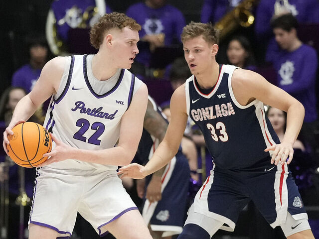 PORTLAND, OREGON - JANUARY 25: Ben Gregg #33 of the Gonzaga Bulldogs plays defense against Austin Rapp #22 of the Portland Pilots during the first half at Chiles Center on January 25, 2025 in Portland, Oregon.