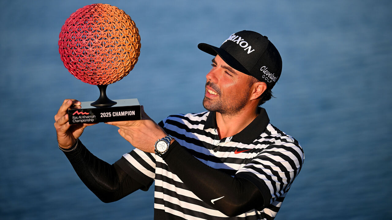 RAS AL KHAIMAH, UNITED ARAB EMIRATES - JANUARY 26: Alejandro Del Rey of Spain kisses the trophy after victory on day four of the Ras Al Khaimah Championship 2025 at Al Hamra Golf Club on January 26, 2025 in Ras al Khaimah, United Arab Emirates.