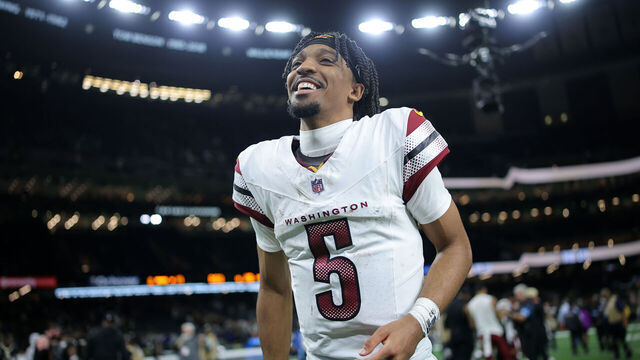 NEW ORLEANS, LOUISIANA - DECEMBER 15: Jayden Daniels #5 of the Washington Commanders reacts against the New Orleans Saints during a game at Caesars Superdome on December 15, 2024 in New Orleans, Louisiana.