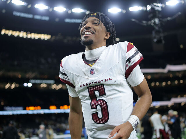 NEW ORLEANS, LOUISIANA - DECEMBER 15: Jayden Daniels #5 of the Washington Commanders reacts against the New Orleans Saints during a game at Caesars Superdome on December 15, 2024 in New Orleans, Louisiana.
