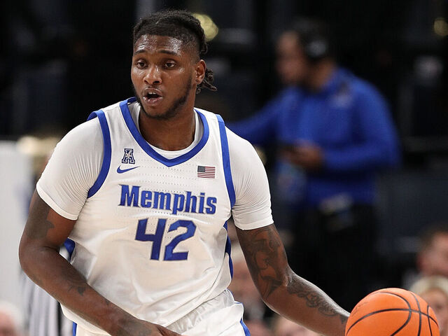 MEMPHIS, TENNESSEE - DECEMBER 04: Dain Dainja #42 of the Memphis Tigers handles the ball during the game against the Louisiana Tech Bulldogs at FedExForum on December 04, 2024 in Memphis, Tennessee.