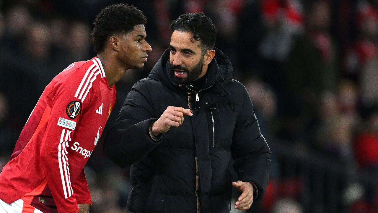 MANCHESTER, ENGLAND - NOVEMBER 28: Ruben Amorim, Head Coach of Manchester United, speaks to Marcus Rashford of Manchester United as he prepares to enter the pitch as a substitute during the UEFA Europa League 2024/25 League Phase MD5 match between Manchester United and FK Bodo/Glimt at Old Trafford on November 28, 2024 in Manchester, England.