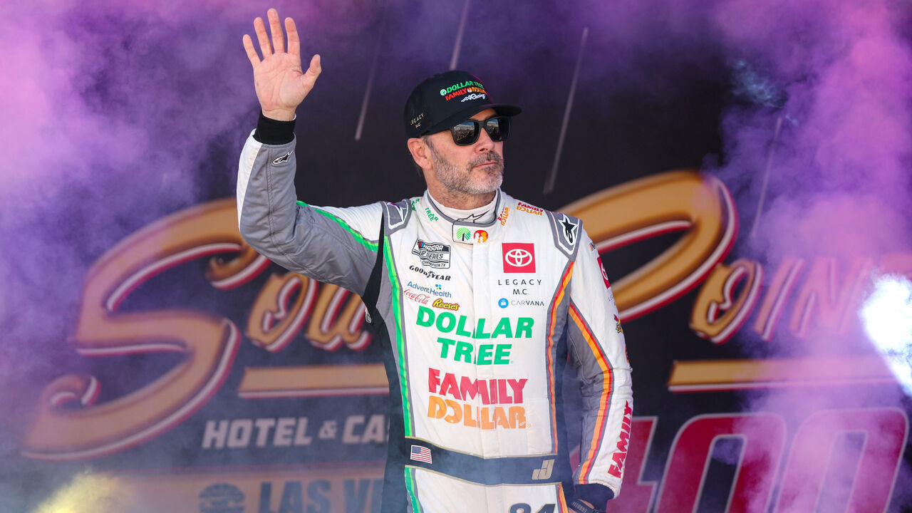 LAS VEGAS, NEVADA - OCTOBER 20: Jimmie Johnson, driver of the #84 Dollar Tree/Family Dollar Toyota, waves to fans as he walks onstage during driver intros prior to the NASCAR Cup Series South Point 400 at Las Vegas Motor Speedway on October 20, 2024 in Las Vegas, Nevada.